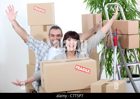 Excited couple on moving day Stock Photo