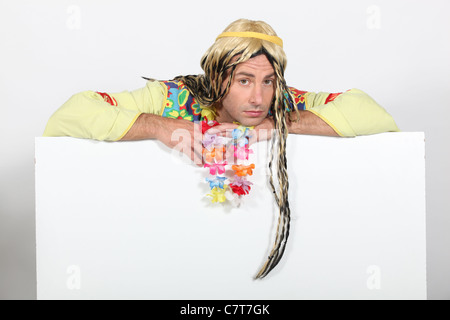 Bored man in hippie costume Stock Photo