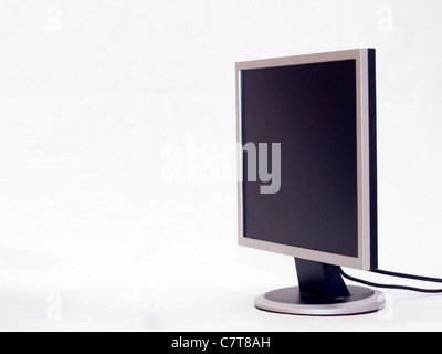 stylish computer in aluminum monitor on a white reflective ground. Stock Photo