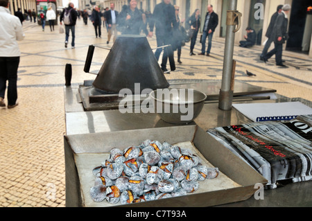 Portugal, Lisbon: Stand with roasted chestnuts in the shopping mall Rua Augusta Stock Photo