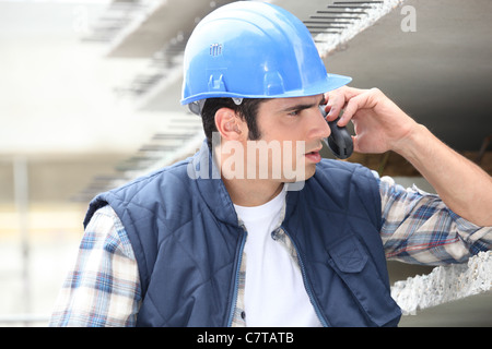 Builder on the phone Stock Photo