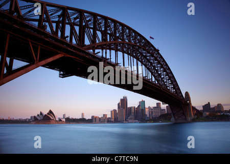 A long exposure looking back to Sydney Bridge and Sydney Opera House at dusk. Stock Photo