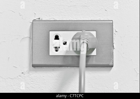 Double electrical power socket and single plug switched on, white Stock ...