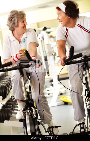 Two retired women spending time in gym Stock Photo