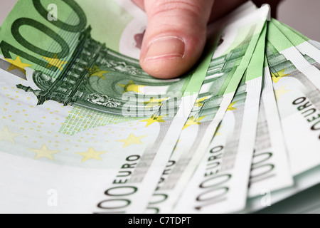 100 euro banknotes in hand close up Stock Photo