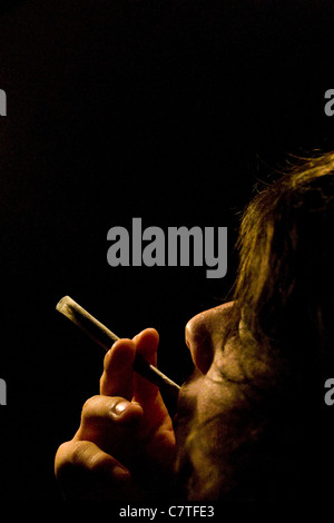 Teen boy smoking joint Stock Photo