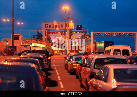 Calais Port at night - cars waiting to board ferry to Dover. Stock Photo