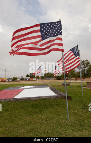 American flags fly daily at the city park in downtown Haskell where Texas First Lady Anita Perry grew up in the 1950's a 1960's Stock Photo
