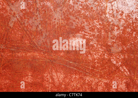 scratched red rusted iron metal for grunge background texture Stock Photo