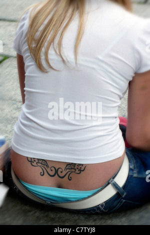 Tatto on woman's back Stock Photo