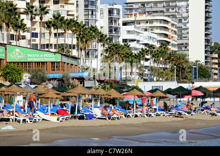 Holidaymakers on the beach, Marbella, Costa del Sol, Malaga Province, Andalucia, Spain, Western Europe. Stock Photo