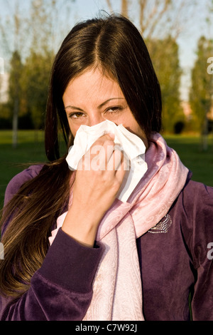 Woman blowing her nose, handkerchief, hanky Stock Photo - Alamy