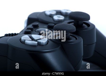 Closeup of black game console controller on white background Stock Photo