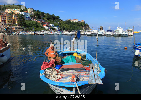 Italy, Campania, Cilento, Harbour, Fisherman Works on his Nets Stock Photo