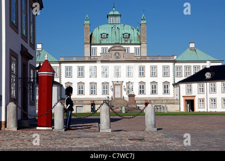 Bearskin sentry from the Royal Life Guards guarding the Fredensborg Palace near Copenhagen, Denmark. Fredensborg Slot. Stock Photo