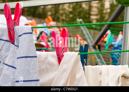 Clothes hanging on a line outside Stock Photo