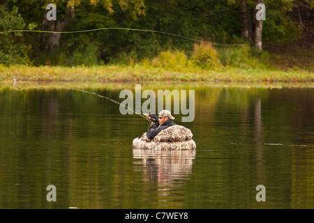 ANCHORAGE, ALASKA, USA - Man fly fishing on pond in Kincaid Park. Stock Photo
