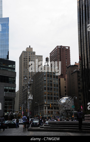 Wet autumn view stainless steel globe sculpture, Trump Hotel plaza, facing Columbus Circle Broadway, Central Park West, New York Stock Photo