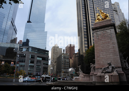 View, across Columbus Circle towards Time Warner and Trump Hotel glass skyscrapers, Maine Monument, Central Park, New York City Stock Photo