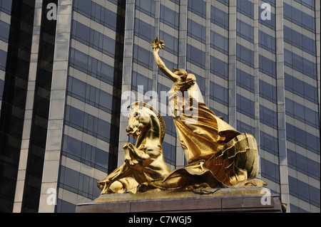 Gilded sculpture Columbia Triumphant and seahorse seashell chariot, top of Maine Monument, Central Park, New York City Stock Photo