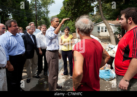President Barack Obama with New Jersey Governor Chris Christie (L) talks with residents effected by hurricane Irene Stock Photo