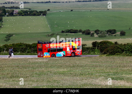 Eastbourne and Beachy Head open topped double decker sightseeing tour bus near Beachy Head , East Sussex , England Stock Photo