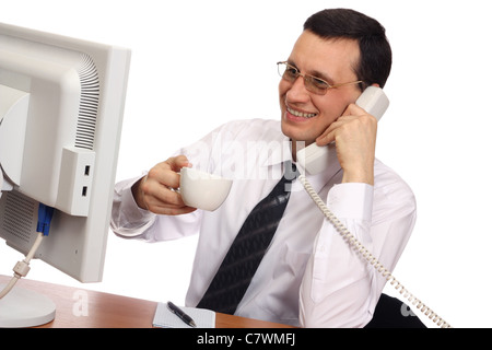 Businessman wearing glasses with a cup in her hand, smiling on the phone on a white background Stock Photo