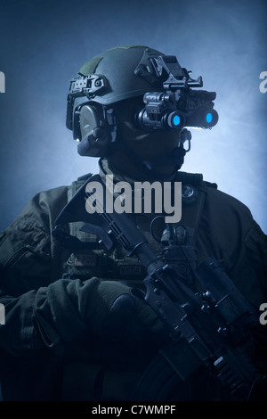 Special operations forces soldier equipped with night vision and an automatic weapon. Stock Photo