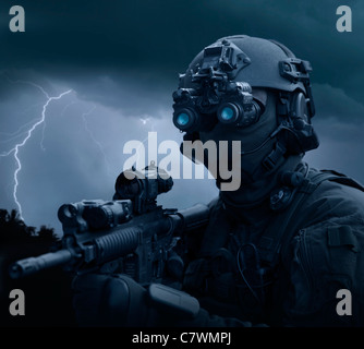 Special operations forces soldier equipped with night vision and an HK416 assault rifle. Stock Photo