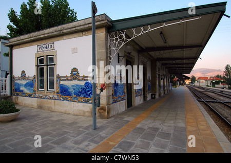 Figurative hand-painted azulejos tiles depicting scenic views of the Douro valley decorate the railway station along the Douro Line in Pinhao village in Douro valley Northern Portugal Stock Photo