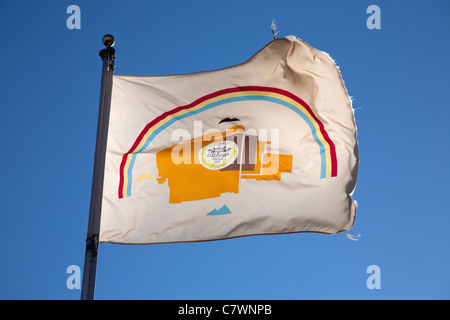 flag of the navajo nation native american indians against a blue summer sky at their headquarters at Window Rock in Arizona Stock Photo