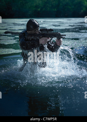 Special Operations Forces Soldier Emerges From Water Armed With A Steyr 