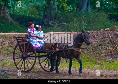 Unidentified participants take a carriage ride in the annual festival 'Patria Gaucha'  in Tacuarembo, Uruguay. Stock Photo