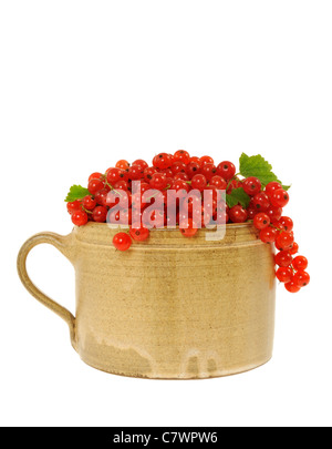 Ceramic cup full of fresh red currant berries. Clipping path included Stock Photo