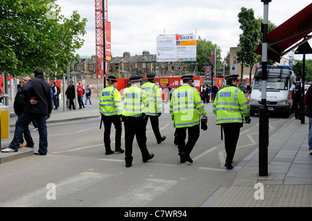 Metropolitan Police Officers patrolling the streets outside the Emirates Stadium during an Arsenal home football match Holloway London England Stock Photo
