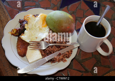 Managua Nicaragua,Bolonia,Hotel Villa Angelo,typical breakfast,food,plate,dish,egg,gallo pinto,rice,beans,coffee,barista,fried plantain,cheese,utensil Stock Photo