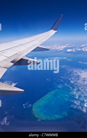 View from airline flying over the Great Barrier Reef Australia Stock Photo