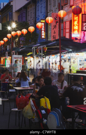 People eating at outdoor restaurants, Chinatown, Singapore  Stock Photo