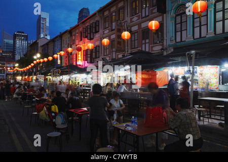 People eating at outdoor restaurants, Chinatown, Singapore  Stock Photo