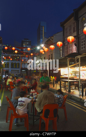 People eating at outdoor restaurants, Chinatown, Singapore  Stock Photo