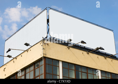 Two large blank billboards with copy space on a building roof Stock Photo