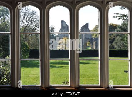 Glastonbury Abbey taken from the interior of Abbey House, Glastonbury. Abbey House is set in the grounds of Glastonbury Abbey. Stock Photo