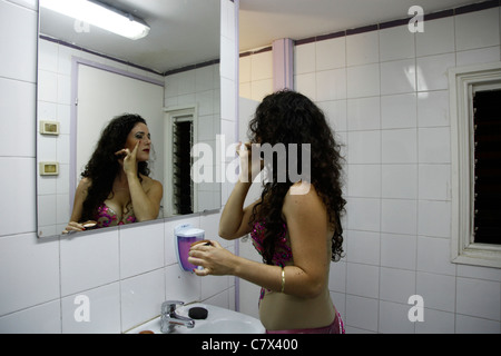 Belly dancer applying make up during annual Israeli belly dance competition in Tel Aviv Israel Stock Photo