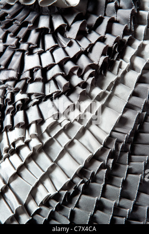 gray ruffled skirt pleated texture fashion background Stock Photo