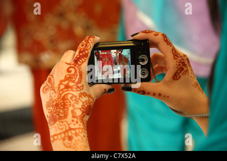 Hands decorated in the Hindu mendhi tradition using henna Stock Photo