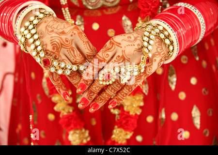 Hands decorated in the Hindu mendhi tradition using henna Stock Photo