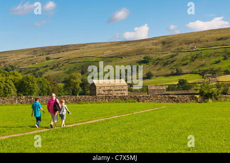A family walking at Muker in Swaledale in North Yorkshire , England , Britain , Uk Stock Photo