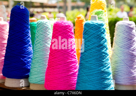 Embroidery colorful thread spool in rows Stock Photo