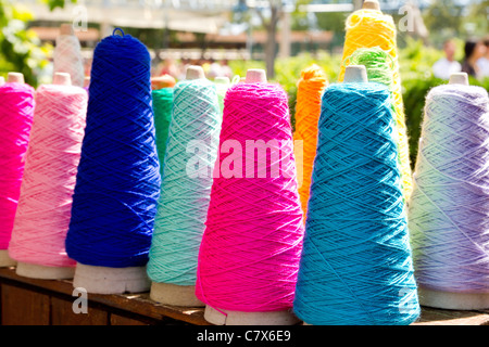 Embroidery colorful thread spool in rows Stock Photo