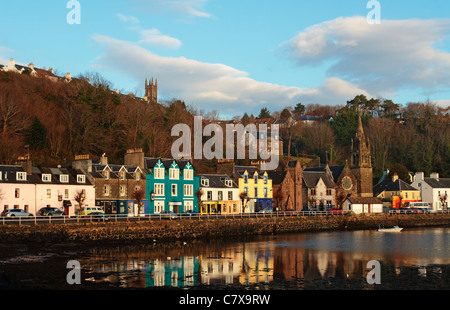Colourful houses along Tobermory quayside reflecting in the still harbour water in Tobermory bay, Isle of Mull, Argyll and Bute, Scotland, UK Stock Photo